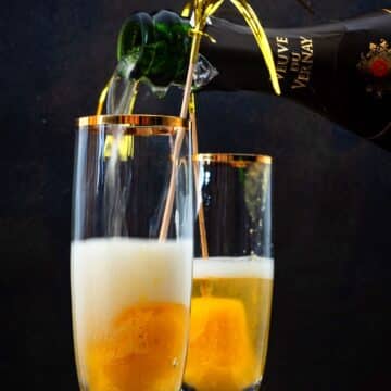 Champagne glasses with peach bellini.