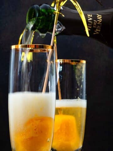 Champagne glasses with peach bellini.