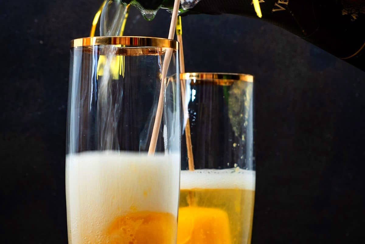 Champagne glasses with peach bellini.