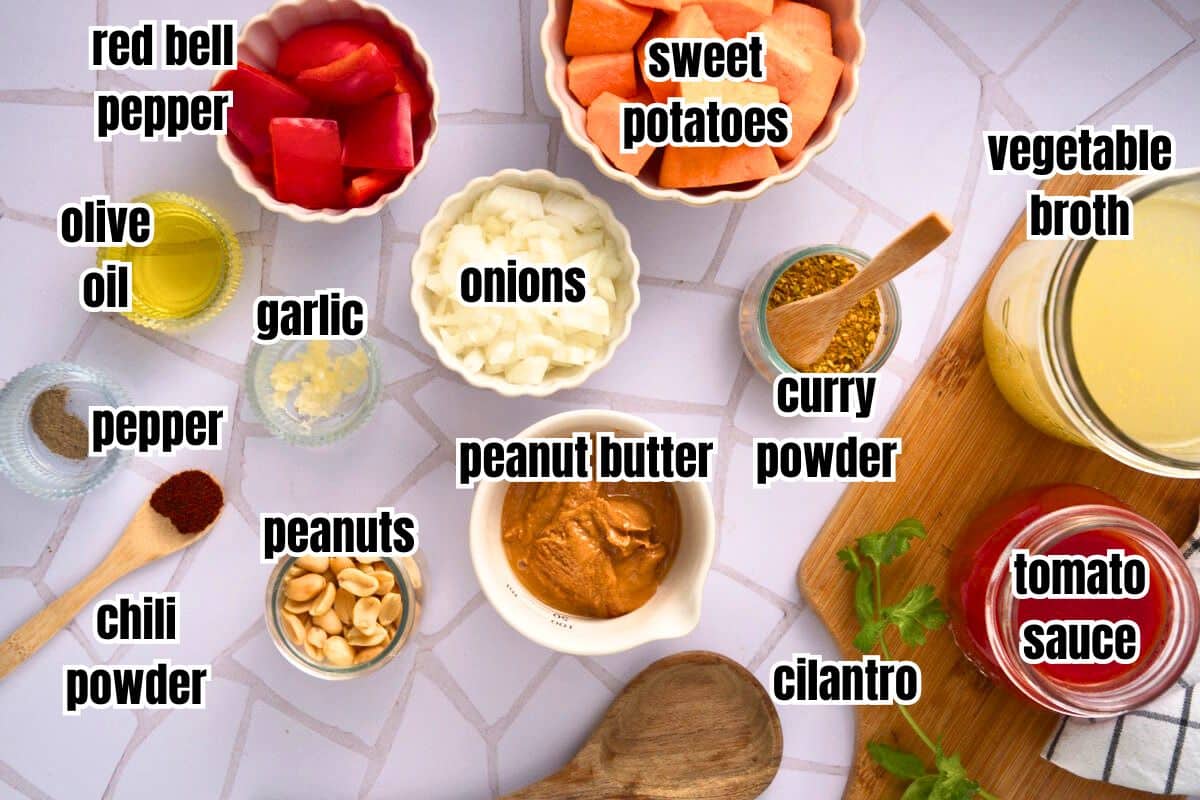 Peanut butter soup ingredients prepped and labeled on light background.