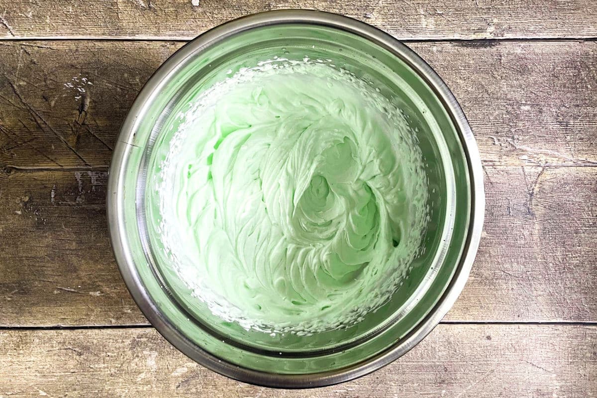 Peppermint whipped cream in bowl.