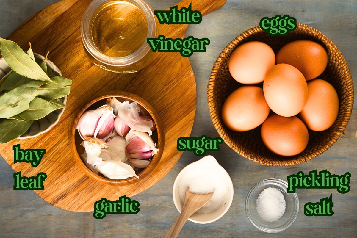 Pickled egg ingredients prepped on wooden board.
