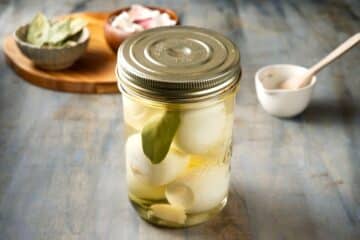 Pickled eggs in a jar with a lid.