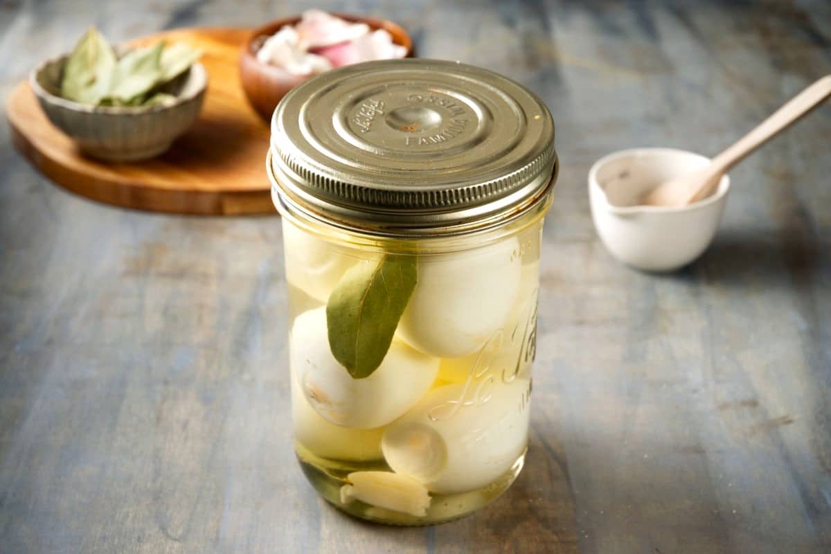 Pickled eggs in a jar with a lid.