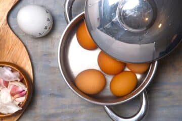 Eggs in saucepan with lid.