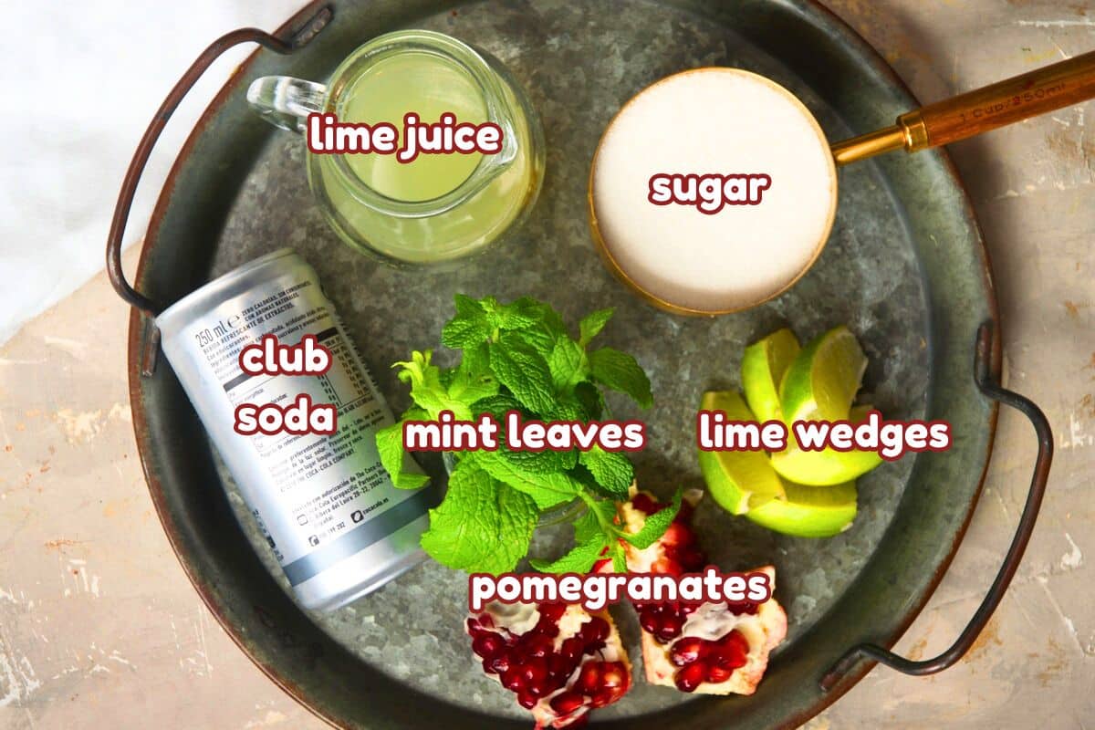 Pomegranate mojito mocktail ingredients labeled.