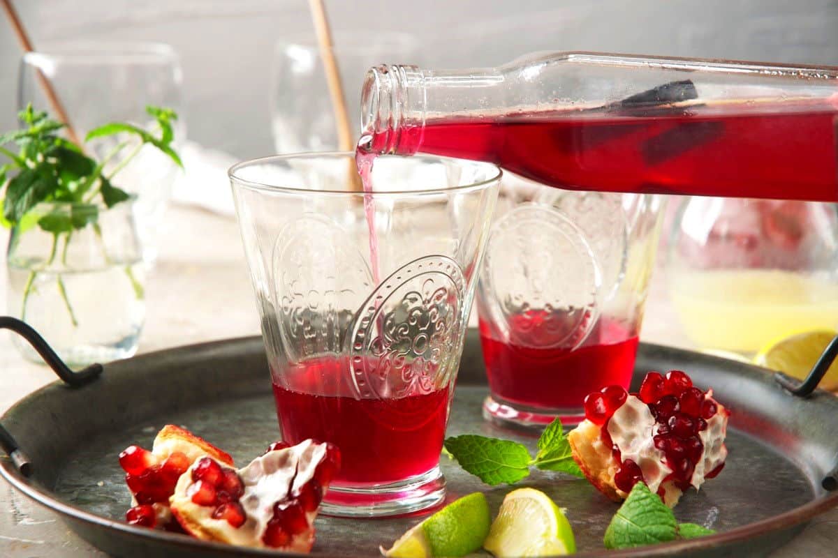 Glasses with pomegranate syrup.