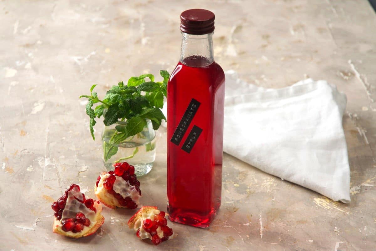 Pomegranate syrup in labeled bottle.