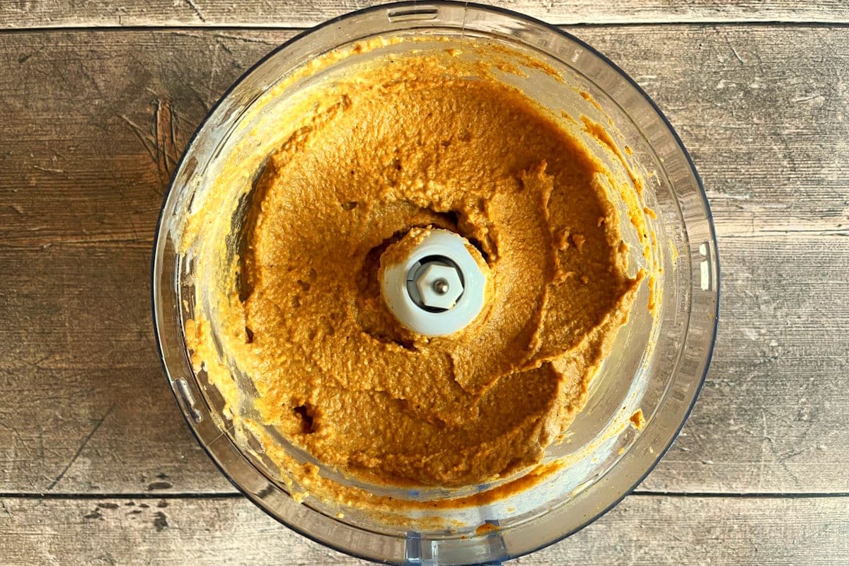 Pumpkin pie hummus blended in food processor.