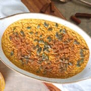 Oven baked pumpkin spice oatmeal in baking dish.