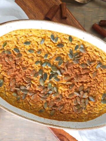Oven baked pumpkin spice oatmeal in baking dish.