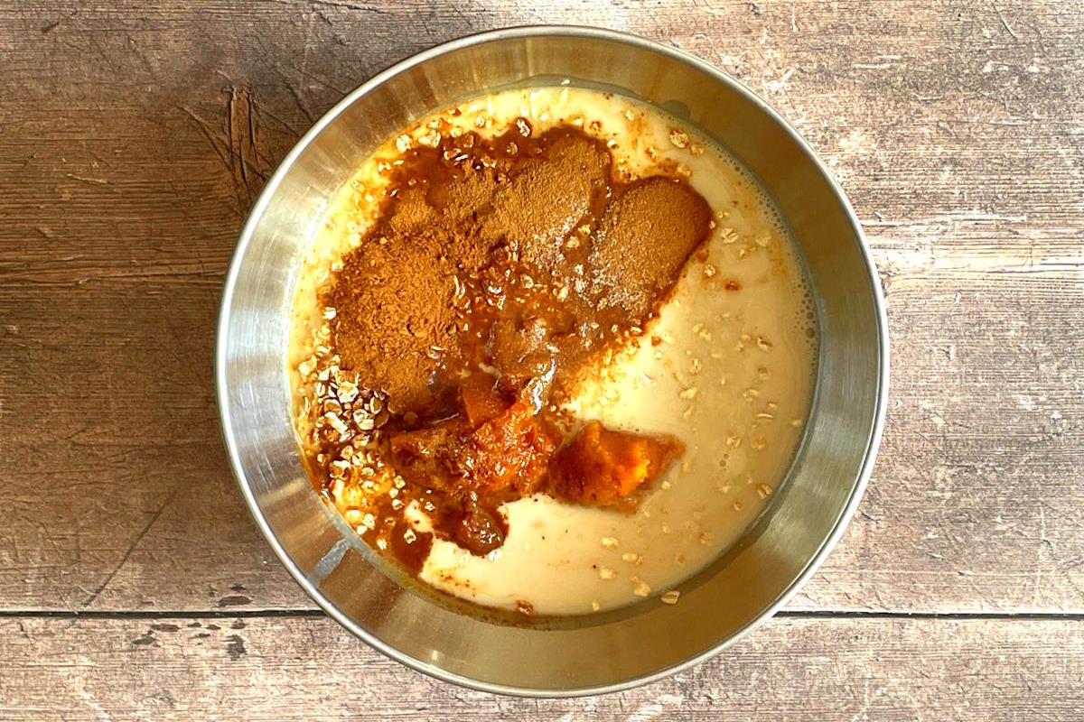 Pumpkin spice oatmeal ingredients in bowl.