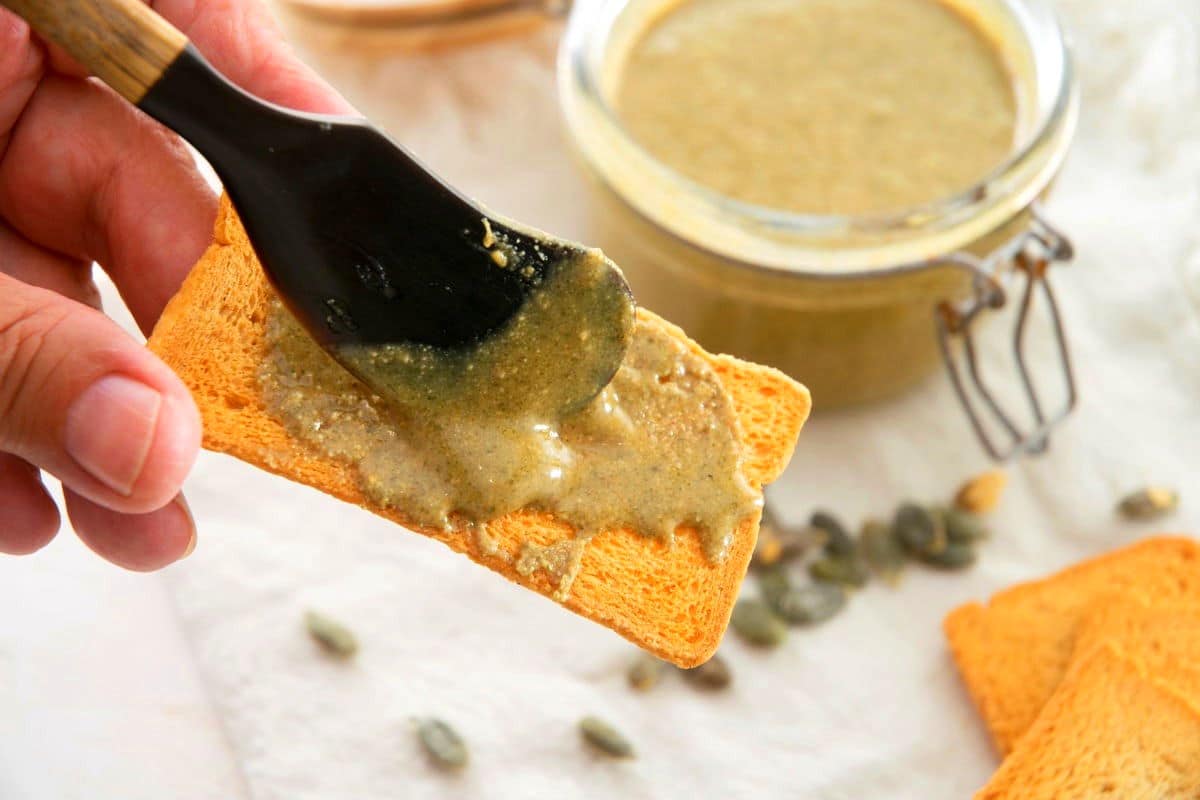 Pumpkin seed butter on cracker.