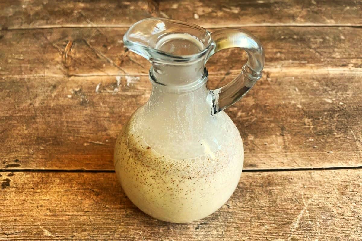 Pumpkin spice creamer in small jar with spout.