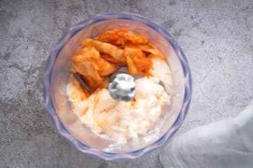 Kimchi mayo ingredients in food processor.
