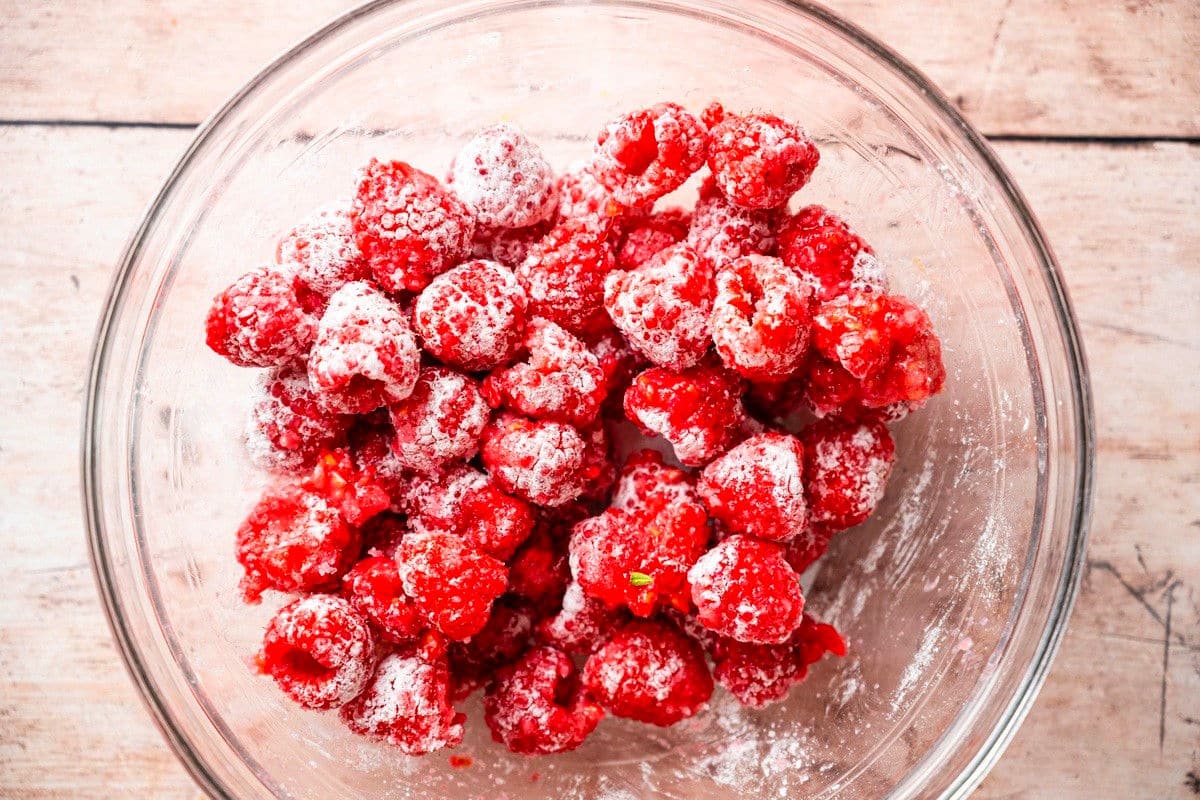 Raspberries in bowl with cornstarch.