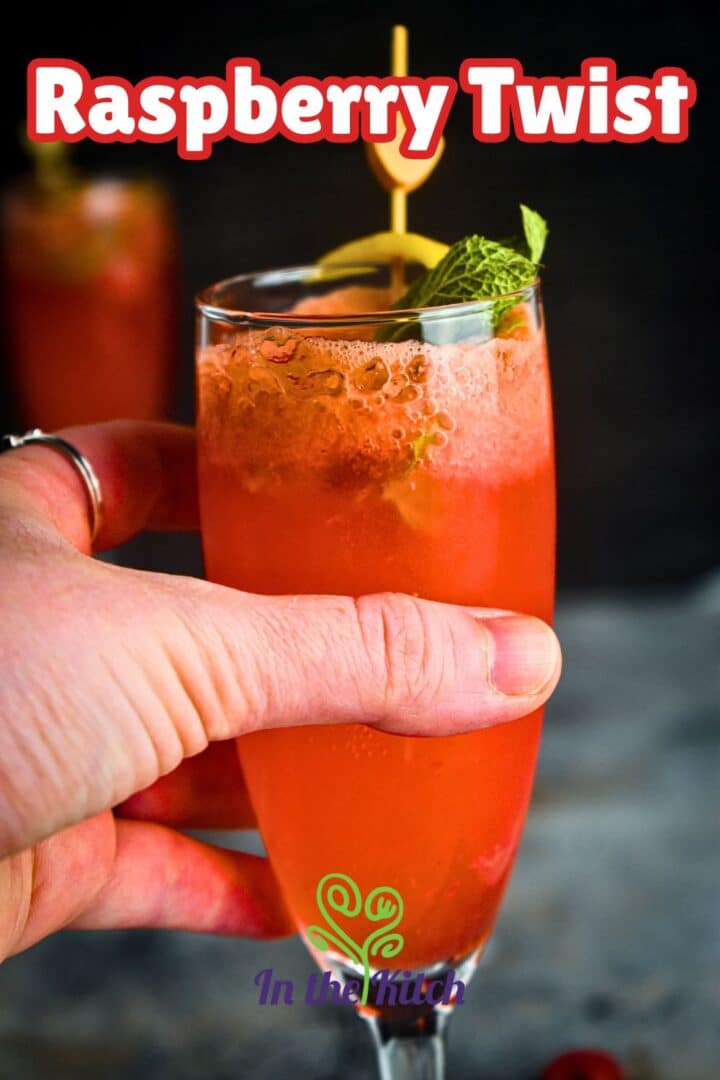 Raspberry twist cocktail in champagne glasses with text overlay that says 'raspberry twist'.