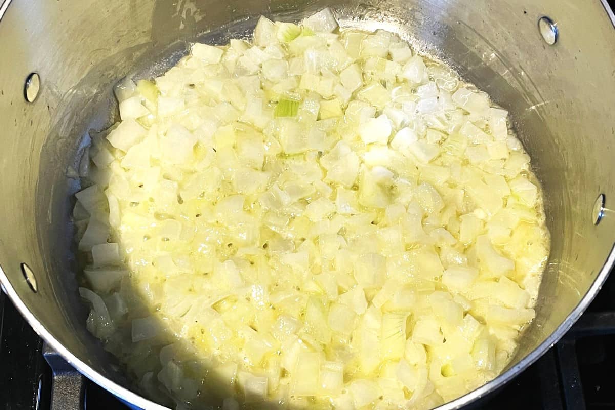 Onions and butter in pot.