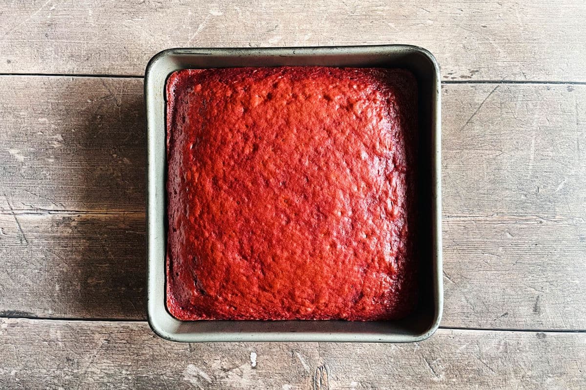 Red velvet cake in pan.