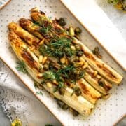 Roasted white asparagus with capers and fresh dill.
