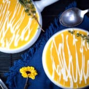 Creamy pumpkin soup in soup bowls.