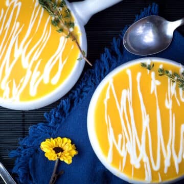 Creamy pumpkin soup in soup bowls.