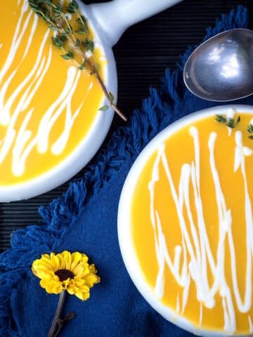 Creamy pumpkin soup in soup bowls.