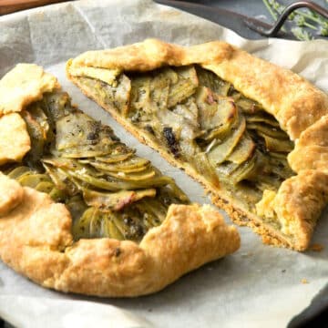 Potato galette with basil pesto sliced in half.