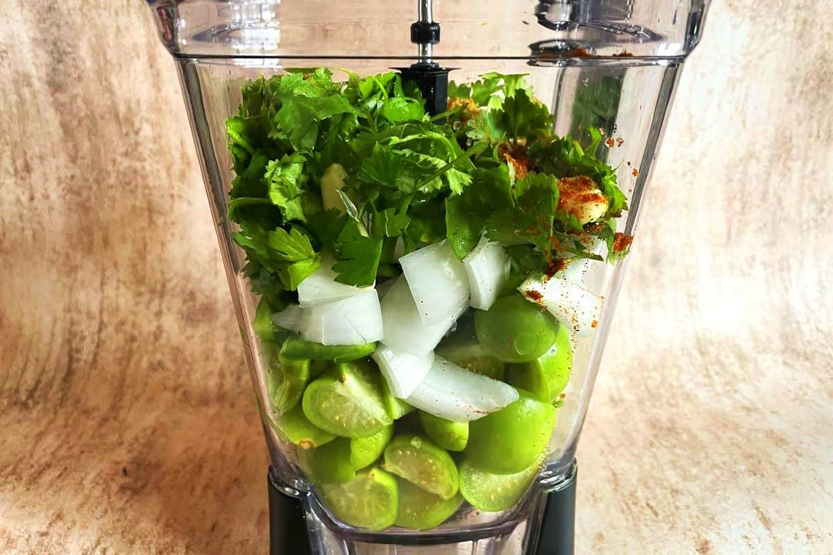 Tomatillo salsa (salsa verde) ingredients in blender.