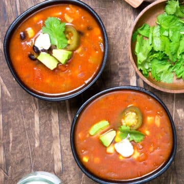 Mexican soup in black bowls.