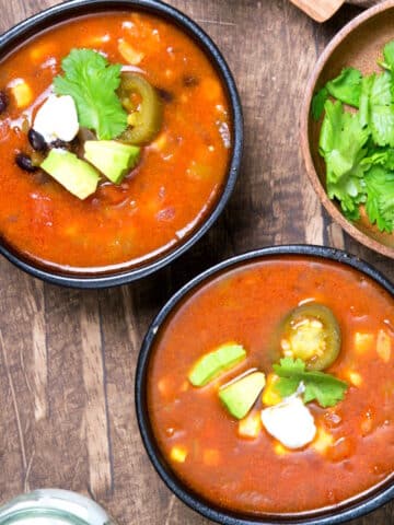 Mexican soup in black bowls.