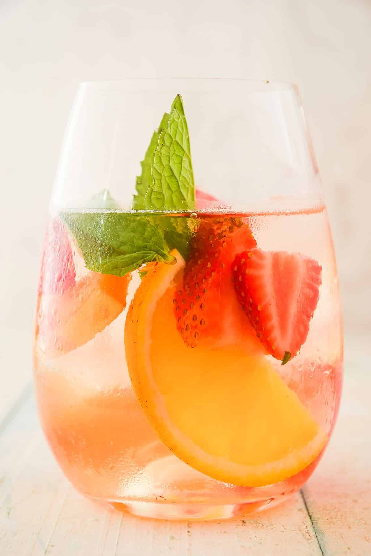 Spring white wine sangria in glass with mint.