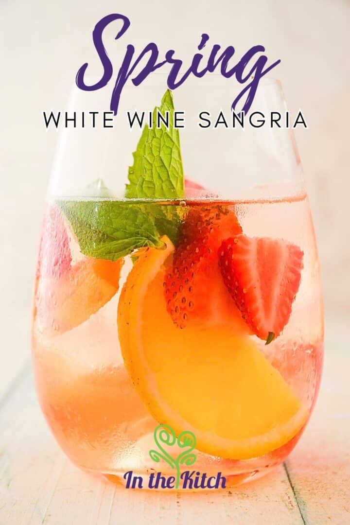 Spring sangria with text overlay that says 'spring white wine sangria'.