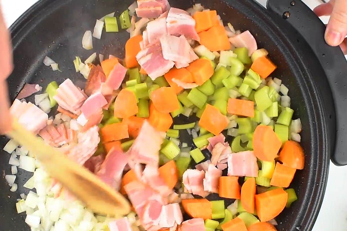 Veggies and bacon in electric skillet.