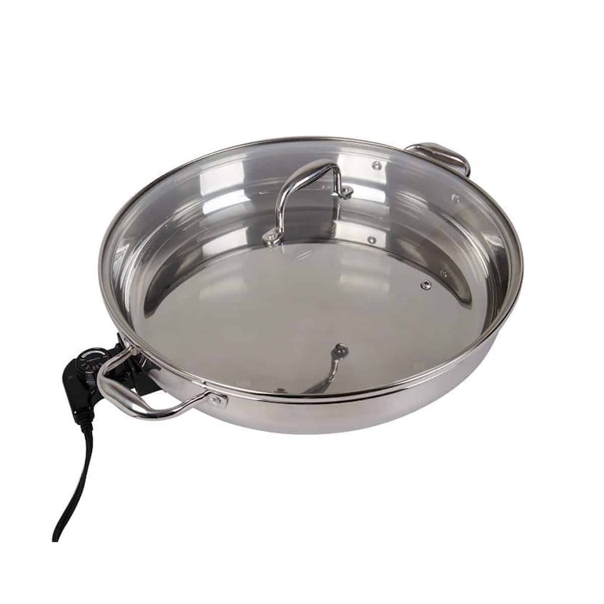 Stainless steel electric skillet isolated on white background.