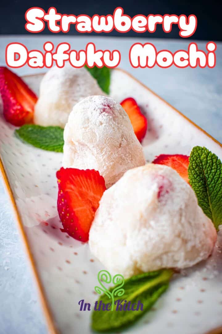 Strawberry daifuki mochi on white serving tray with text overlay.