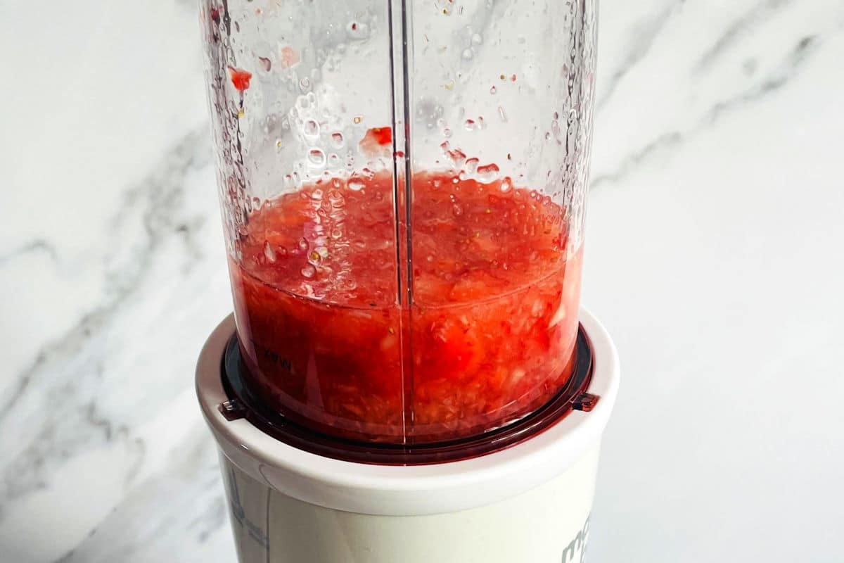 Strawberries and champagne in blender.