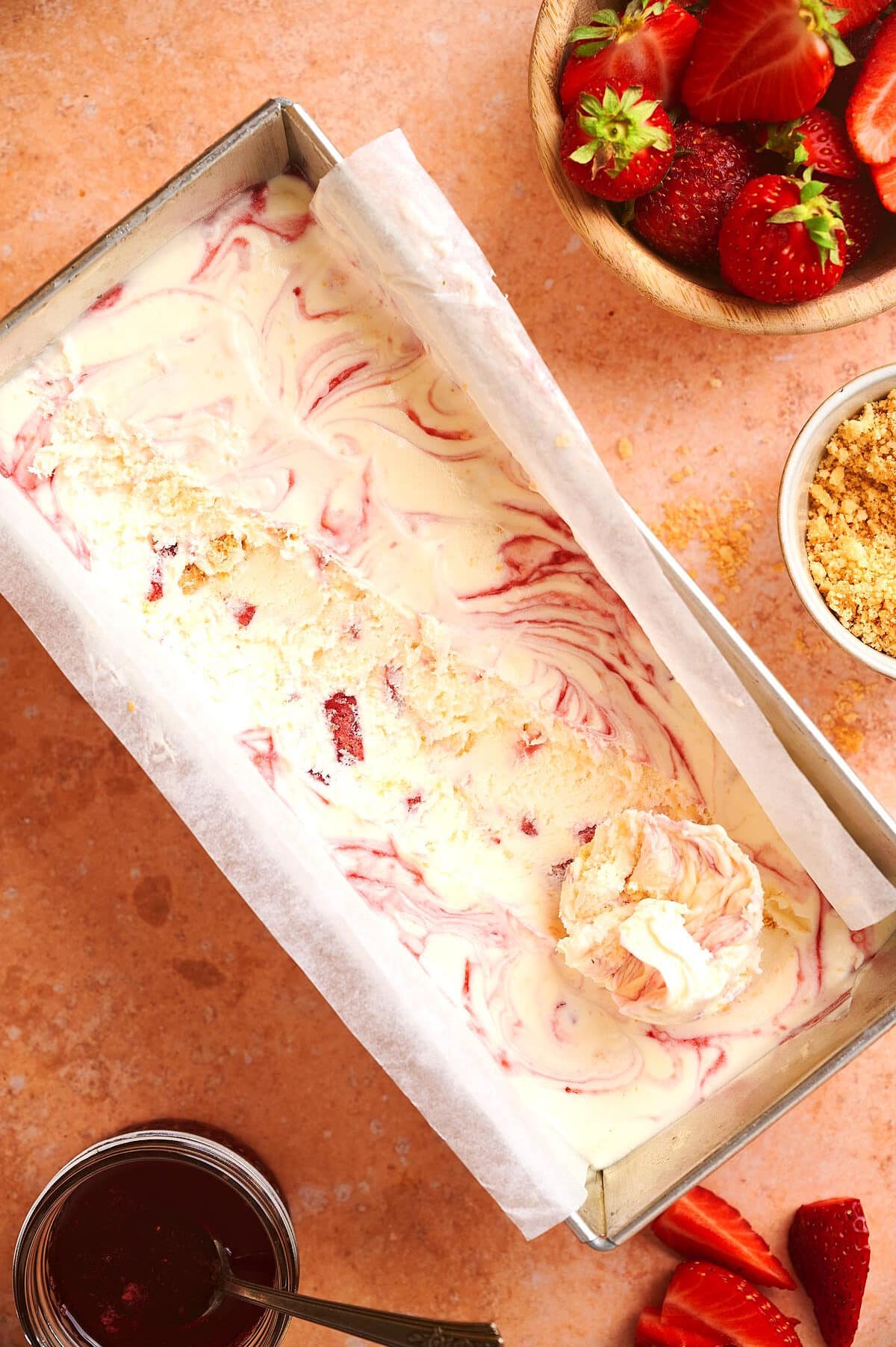 Strawberry shortcake ice cream in a loaf pan.