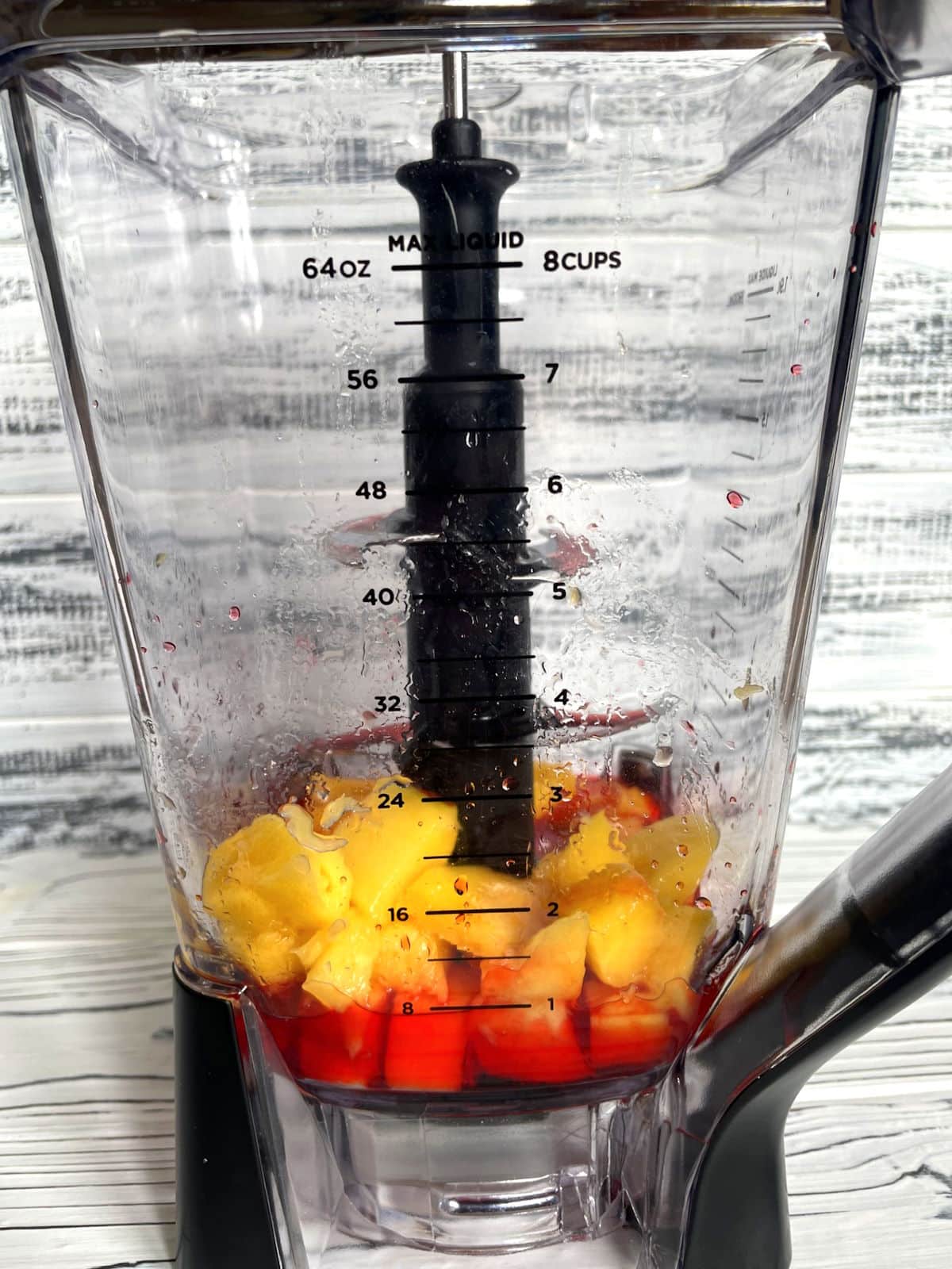 Mangoes and grenadine in blender.