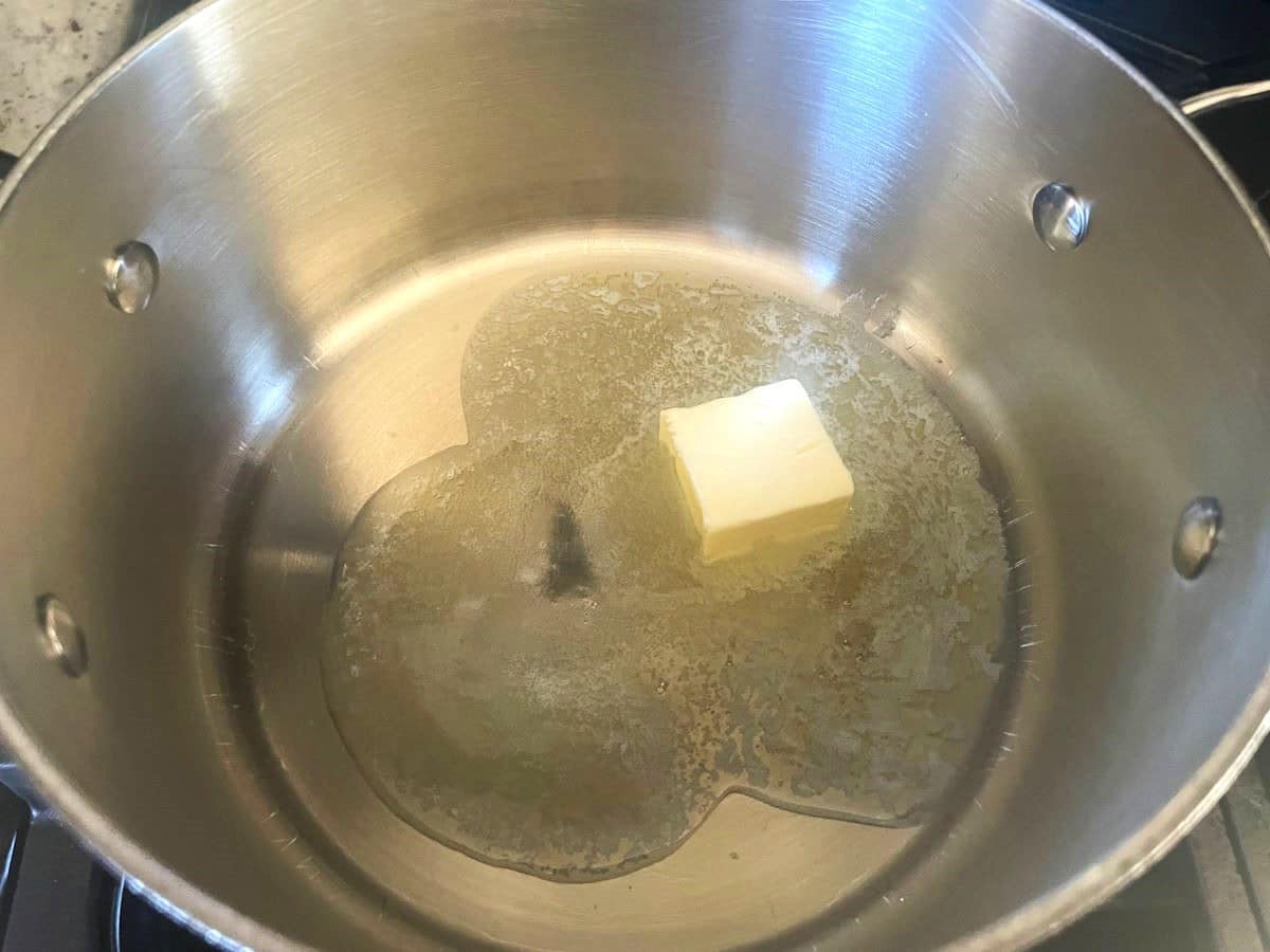 Butter melting in pot.