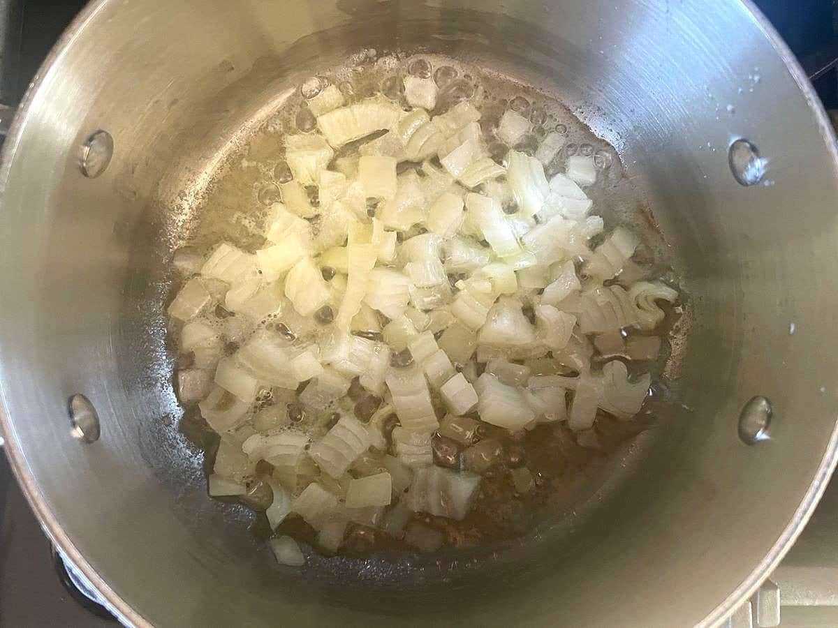 Onions cooking in pot.