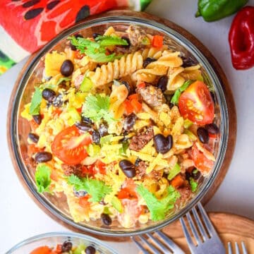 Taco pasta salad in a bowl with forks on the side.