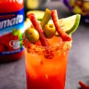 Takis Caesar in a glass.