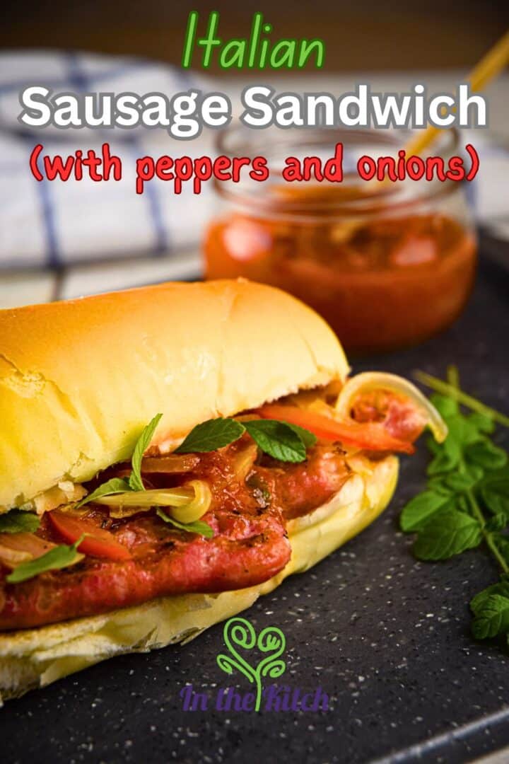 Italian sausage sandwich on black cutting board.