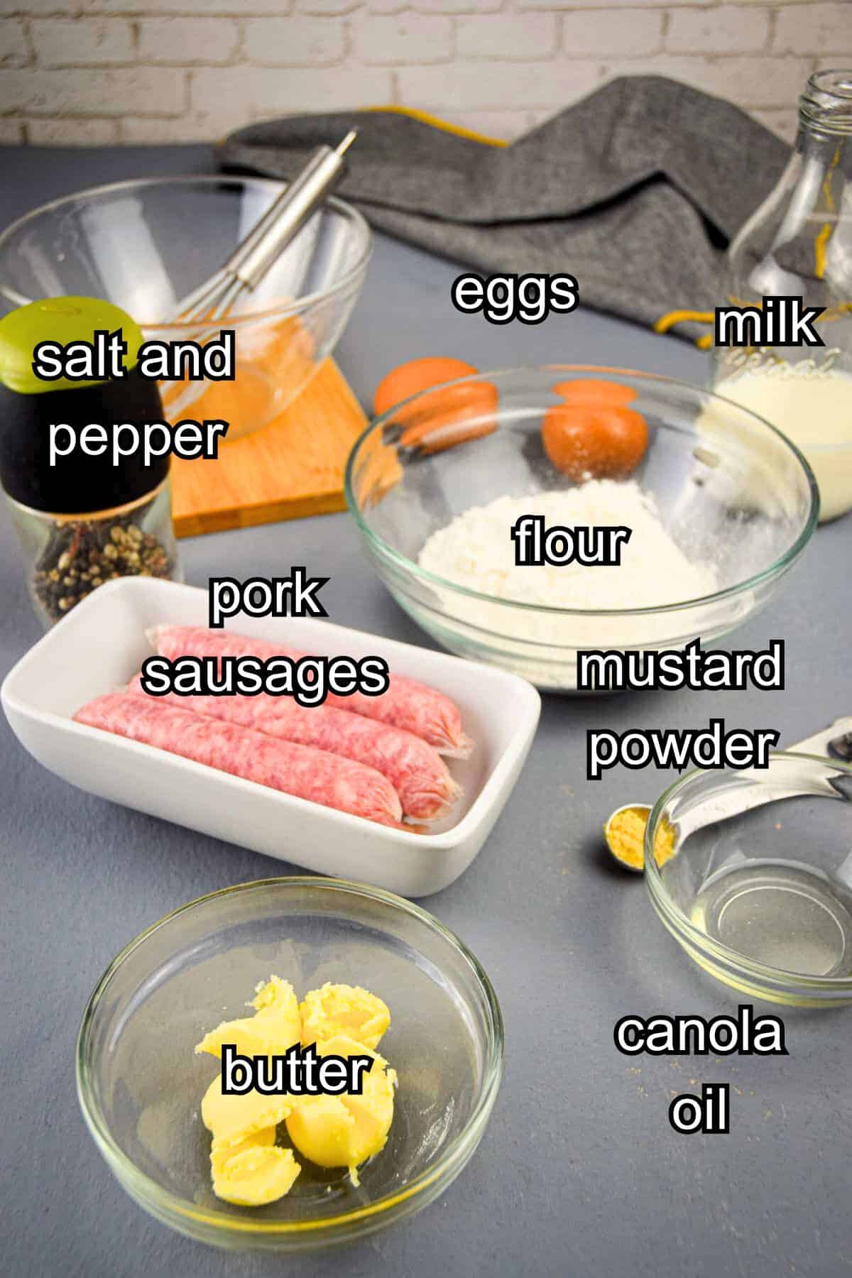 Toad in the hole ingredients labeled on grey background.
