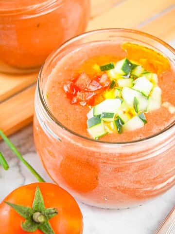 Tomato & Watermelon Gazpacho Soup in a small, wide jar.