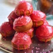 Valentine's day cake balls stacked on plate.