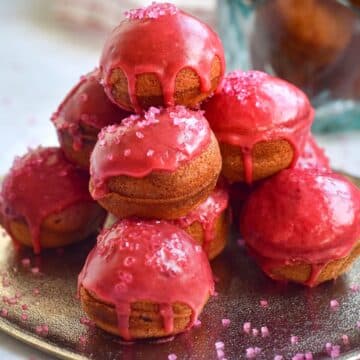 Valentine's day cake balls stacked on plate.