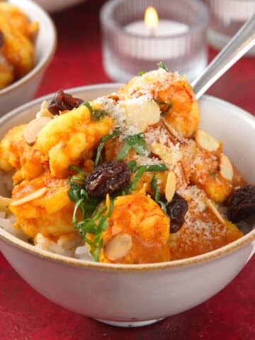 Shrimp curry with rice in bowl.