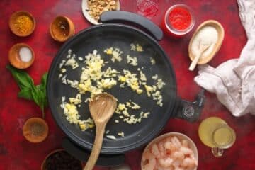 Cooked onions, ginger and garlic in electric skillet.
